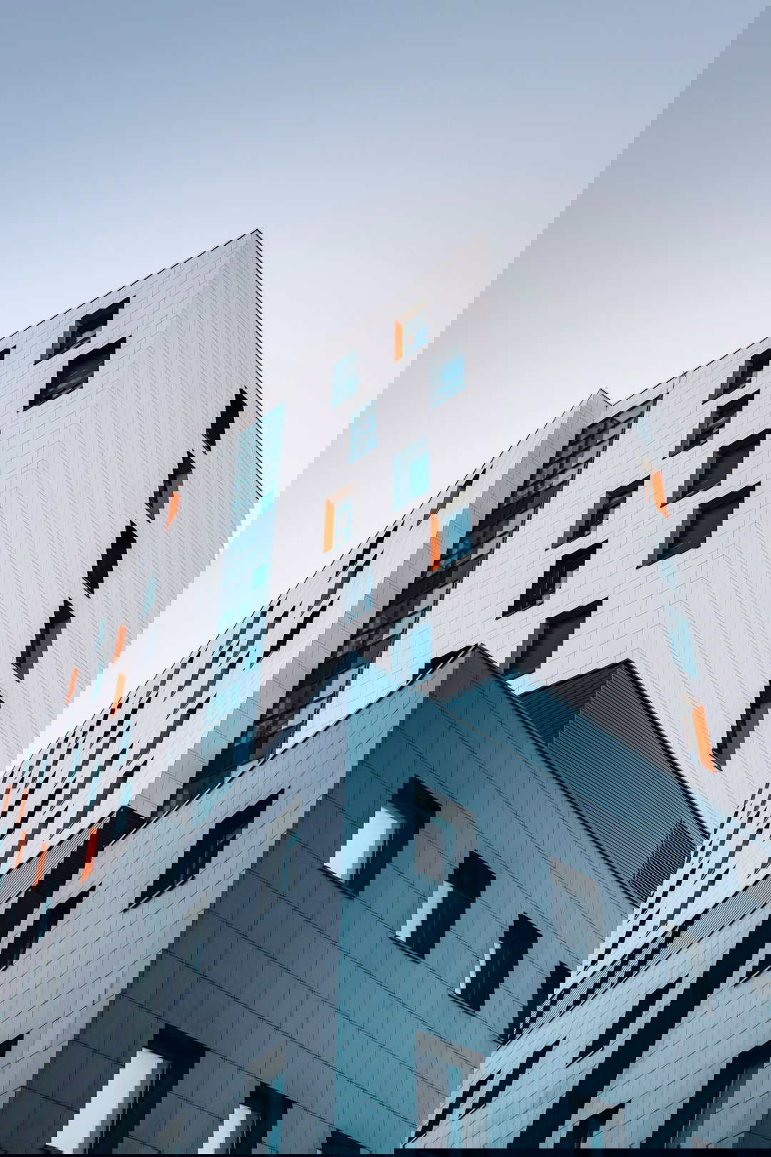 blue and white building across sky